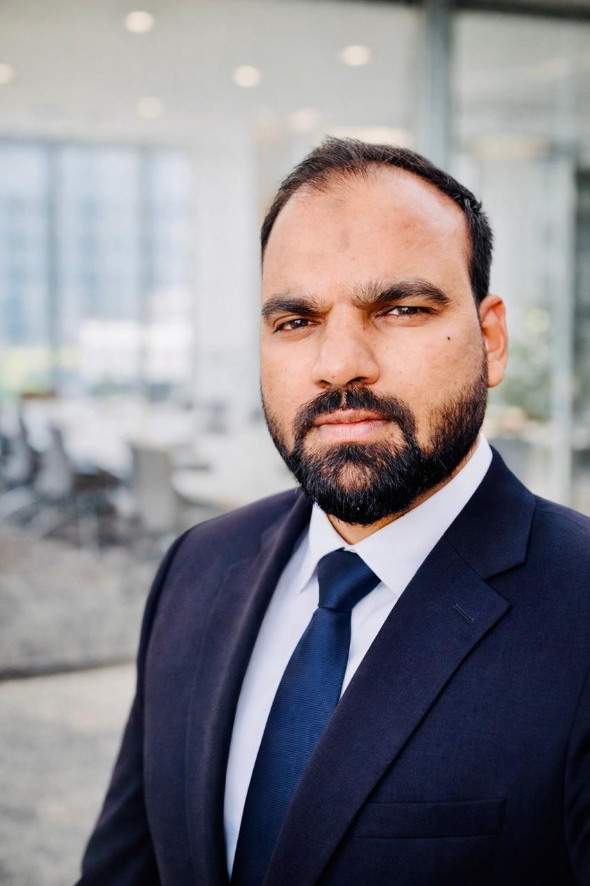 Moin Ashraf, Founder of Asra Global — standing in a professional setting in Agra, India