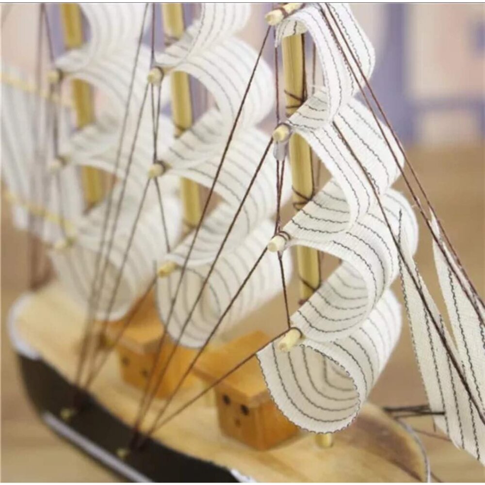 Handcrafted wooden sailing ship showpiece