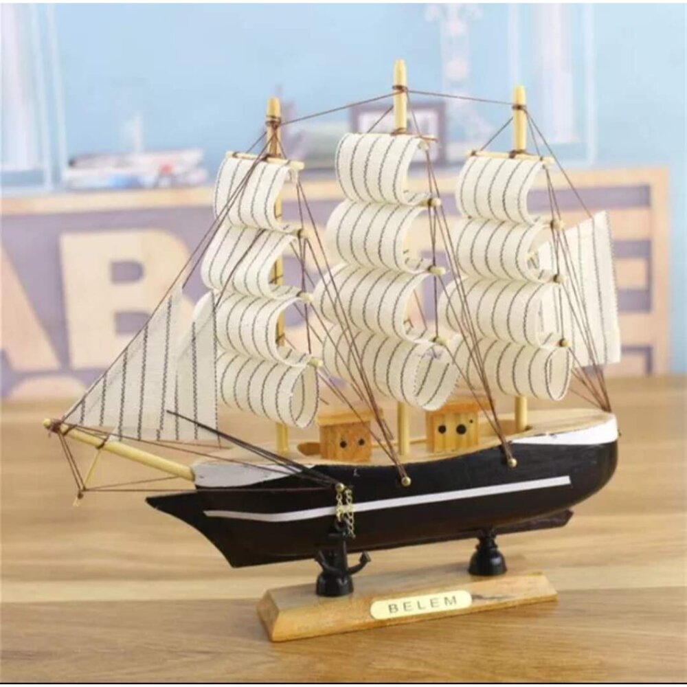 Handcrafted wooden sailing ship showpiece