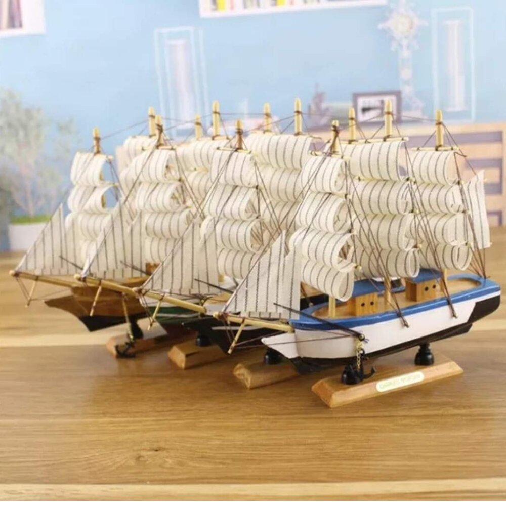 Handcrafted wooden sailing ship showpiece